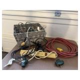 Basket of extension, power cords, surge protector