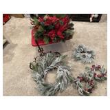 Storage tote, wreaths, holiday greenery