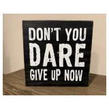 'Don't You Dare GIve Up Now' sign