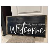'Every Family Has a Story, Welcome to Ours' sign