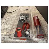 Corkscrews, bottle openers, stoppers, pourer