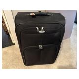 Suitcase, bath robe, toilet tissue holder