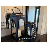 Black lanterns, candles, beaded garland