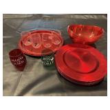 Red chargers, plastic stemless wine glasses,