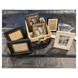Lined wicker basket, picture frames, album pages