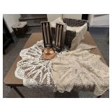 Crocheted table cloths, copper candle, runner