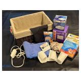 Lined wicker basket, heating pad, first aid