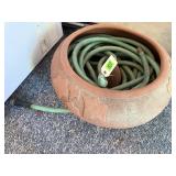 Clay garden pot, garden hose