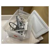 Plastic tote, power cords, surge protectors