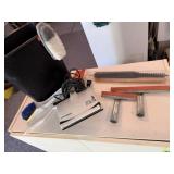 Trash bin, scrub brushes, electric window cleaner