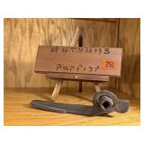 "Nuthuns Purfict" sign, primitive handle
