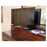 Samsung 32" television, remote controls