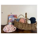 Basket of yarn, stocking hat, crochet book