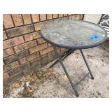 Round glass patio table