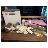 Storage cube of craft supplies, pom poms, balsa