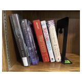 Hard cover fiction book collection, bookend