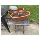 Wooden patio table, plastic planters, flower pots