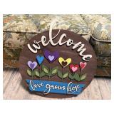 Welcome "Love Grows Here" sign