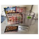 Wire basket of cookbooks, plastic pitcher