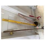 Metal pail, mop handle, yardsticks