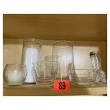 Shelf of glassware, candleholders, bowls