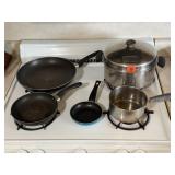 Assorted pots, pans, skillets