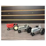 Three toy tractors