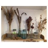 Barnwood shelf, canning jars, bottles of dried