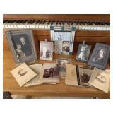 Black & white photographs, picture frames, fork