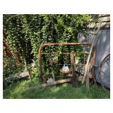 Full size metal headboard, yard tools, saws,