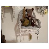 Wicker chair, teddy bear, decorative top, spool