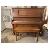 Piano, piano bench, music books