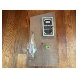 Glass weather barometer mounted on barn wood