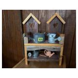 Birdhouse wall shelf, miniature watering cans,