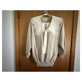 Beige pleated skirt, matching sweater