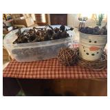Checked runner, snowman pail, pinecones,