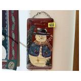 Hand painted snowman on license plate