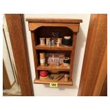 Wall curio of sewing notions