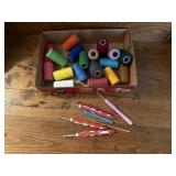 Spools of thread, crochet needles