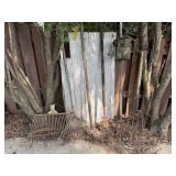 Barn door, yard tools, hay fork, weeders, rake
