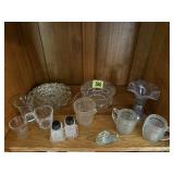 Shelf of glassware, shot glasses, salt & pepper,