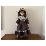 Porcelain doll with stand
