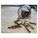 Glass jar of clothespins
