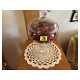 Glass pedestal dish of potpourri, doilie