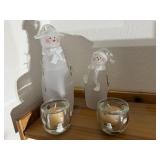 Glass snowmen, votive candles