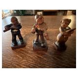 Wood carved musician trio