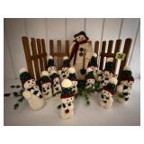 Handmade snowman village, picket fence