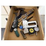Contents of tool drawer, stapler, screwdrivers,