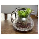 Glass pitcher, artificial plant