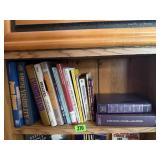 Shelf of assorted books